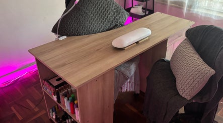 Manicure station at Blom's Beauty Bar, Boksburg, Gauteng, ZA with polishes and a comfy chair.