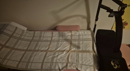 A cozy treatment table at Deborah Jane hair and beauty, Buckfast, England, GB, prepared for client comfort.