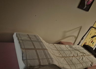 Comfortable therapy bed in Deborah Jane hair and beauty, Buckfast, England, GB, enhancing wellness.