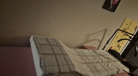 Comfortable therapy bed in Deborah Jane hair and beauty, Buckfast, England, GB, enhancing wellness.