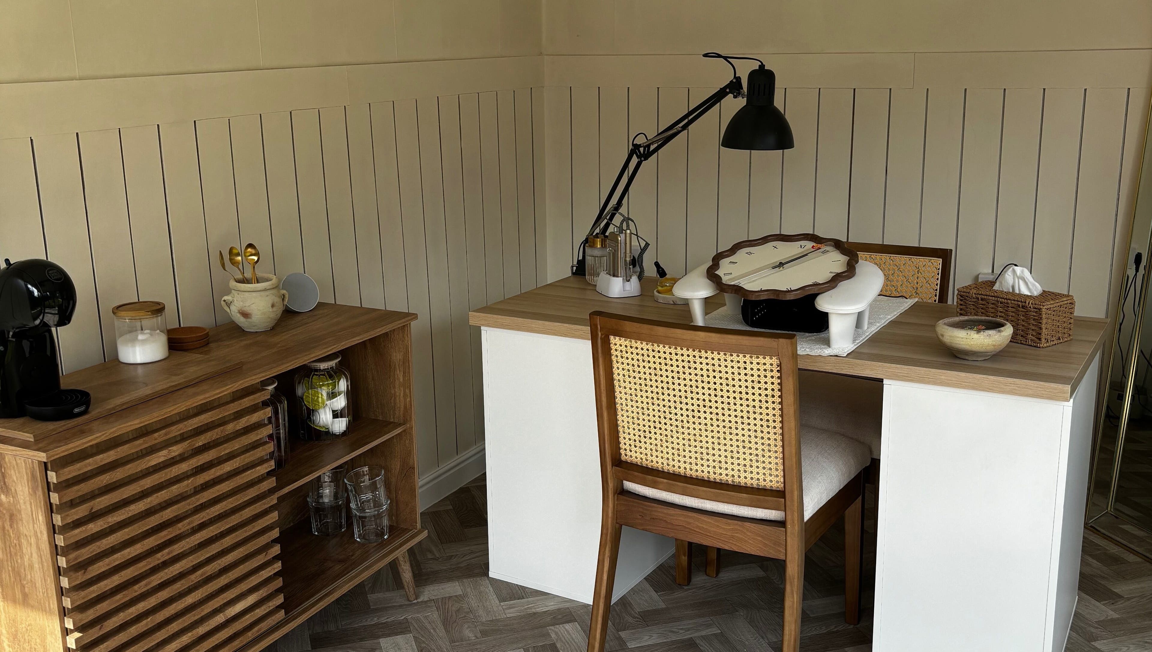 Chic nail studio setup at Mollys Nail Studio in Bridgend, Wales, GB; elegant desk, lamp, and rustic decor.
