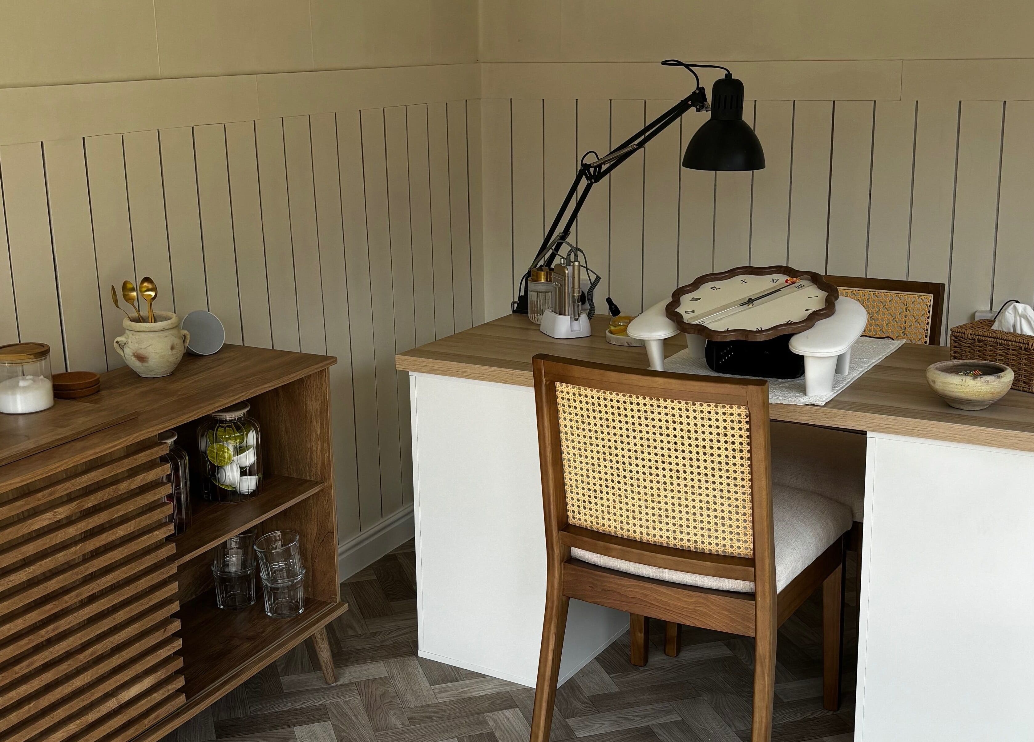 Chic nail studio setup at Mollys Nail Studio in Bridgend, Wales, GB; elegant desk, lamp, and rustic decor.