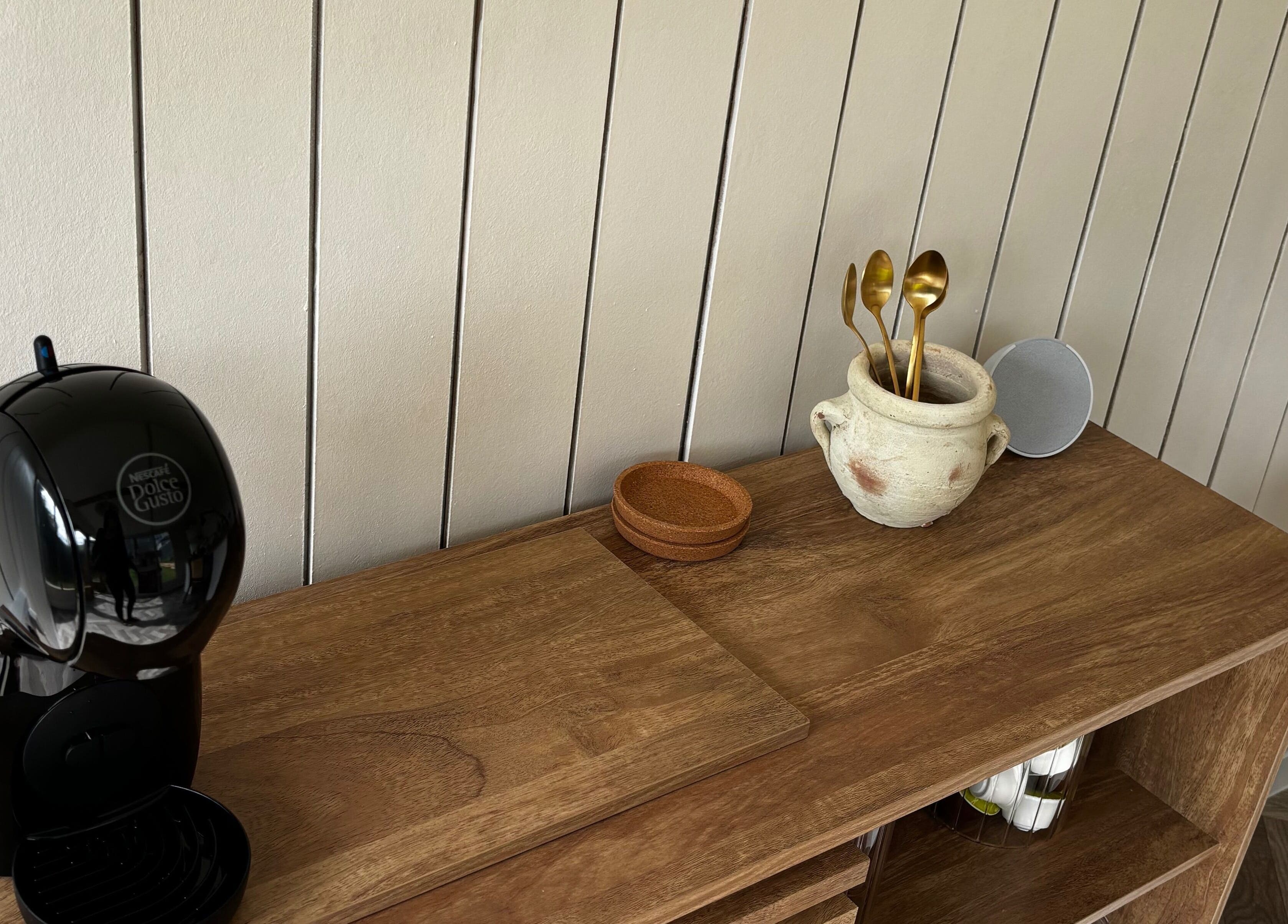 Elegant coffee setup at Mollys Nail Studio, Bridgend, Wales, GB with chic wooden decor.