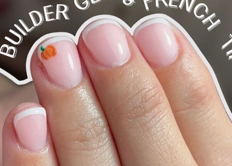 French tips with pumpkin nail art at Mollys Nail Studio, Bridgend, Wales, GB.