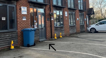 Exterior view of Hair By Hope in Knowle, England, GB with parking area and entrance.