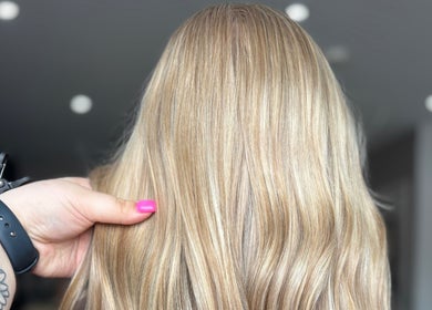 Freshly styled blonde hair at Hair By Hope, Knowle, England, GB, showcasing vibrant color and shine.