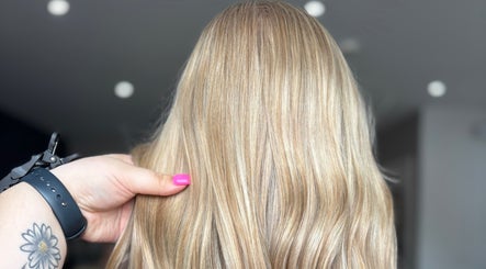 Freshly styled blonde hair at Hair By Hope, Knowle, England, GB, showcasing vibrant color and shine.