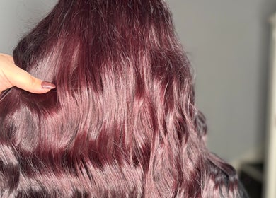 Stunning violet hair transformation at Hair By Hope, Knowle, England, GB, showcasing rich color and shine.
