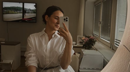 Woman taking selfie in cozy room at With love, Christi, Düsseldorf, Nordrhein-westfalen, DE.