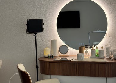 Elegant vanity at 'With love, Christi' in Düsseldorf, Nordrhein-westfalen, DE with illuminated round mirror.