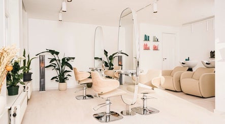 Modern salon interior at Shah Saatchi, Amsterdam, Noord-Holland, NL with elegant chairs and decor.