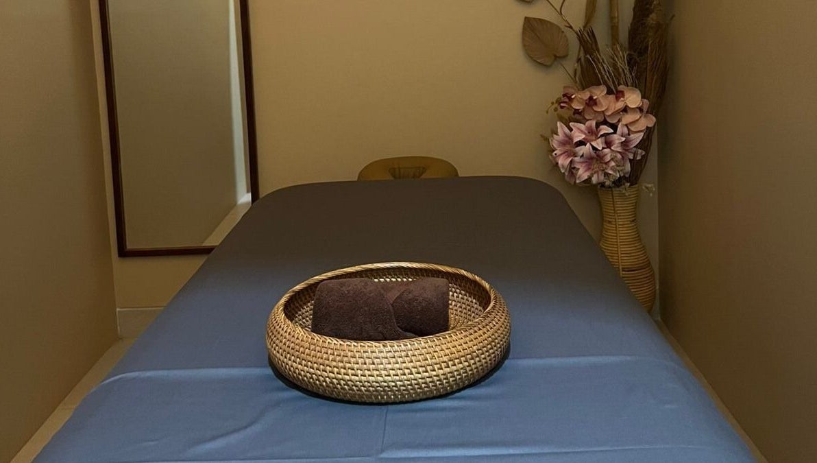 Tranquil treatment room at BeautyfulSpa, Bali, Bali, ID, featuring a massage table and floral decor.