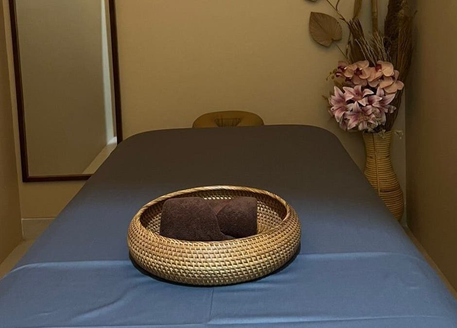 Tranquil treatment room at BeautyfulSpa, Bali, Bali, ID, featuring a massage table and floral decor.