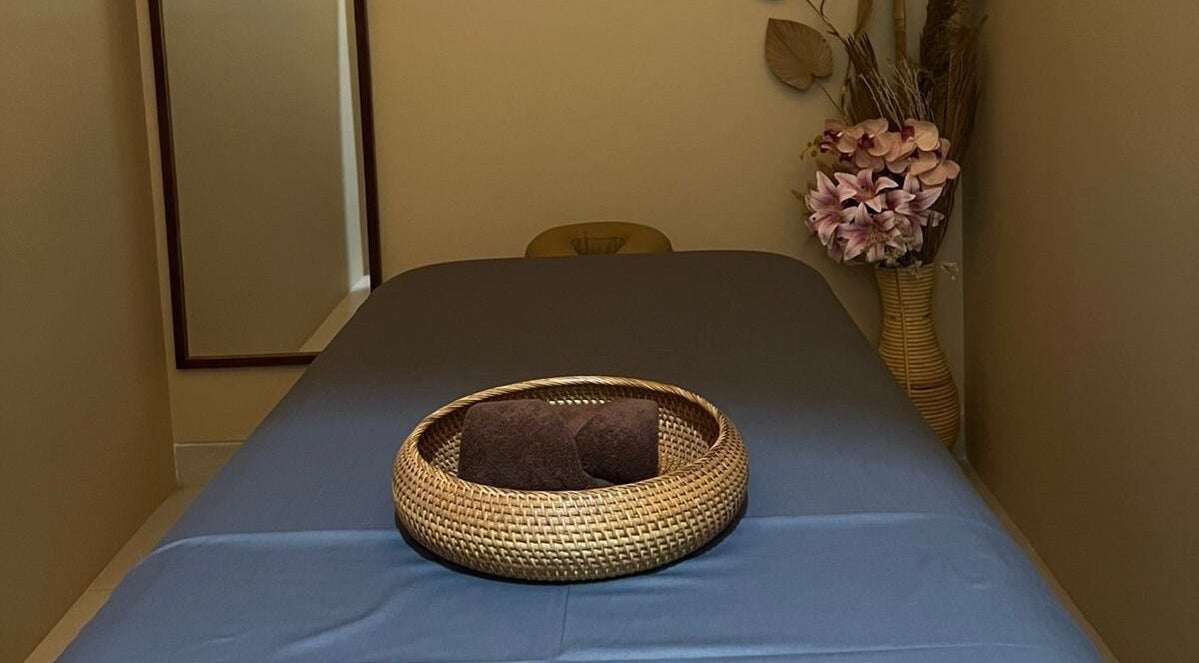 Tranquil treatment room at BeautyfulSpa, Bali, Bali, ID, featuring a massage table and floral decor.
