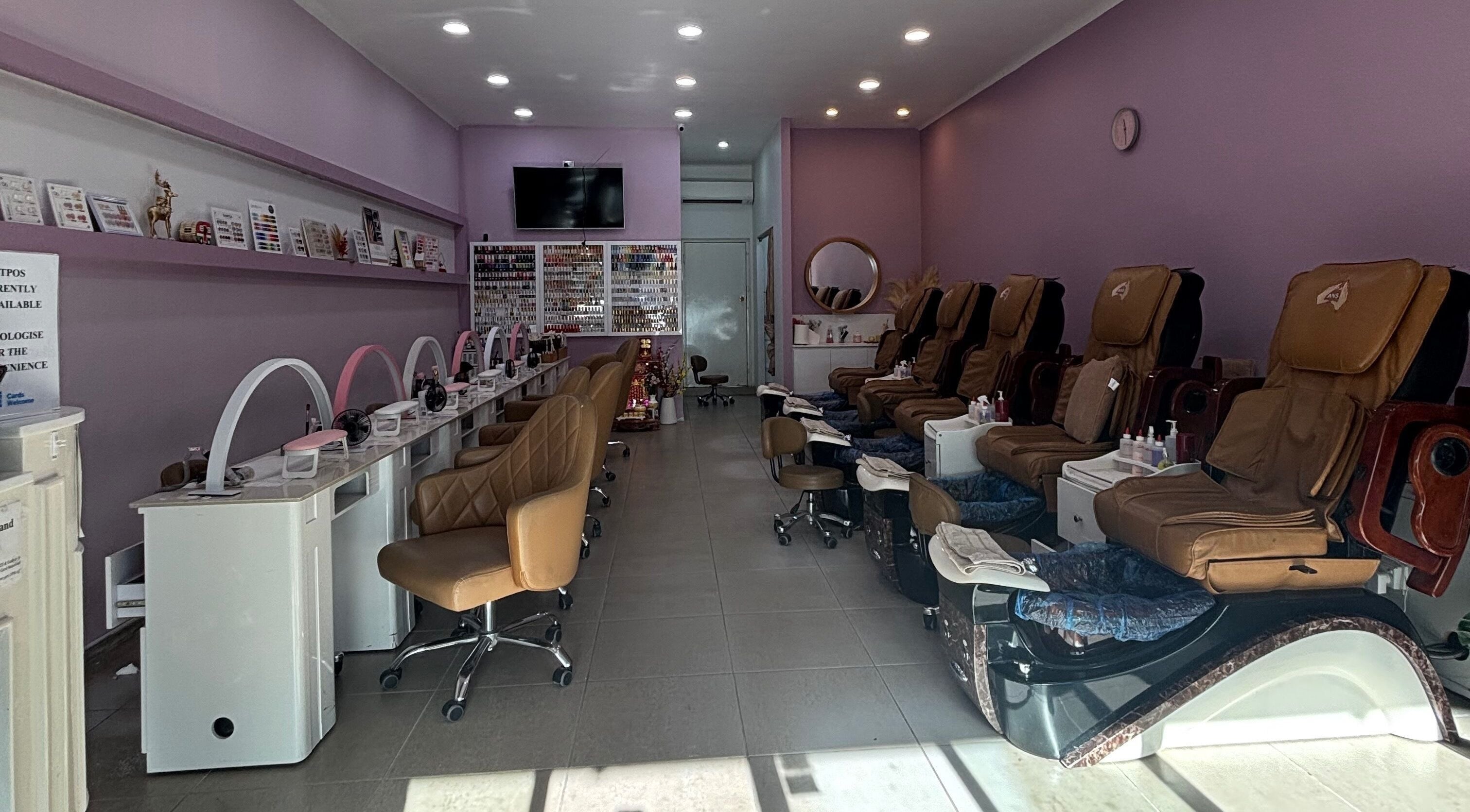 Interior of Rose Nails & Beauty, Forestville, NSW, AU, featuring plush pedicure chairs and nail stations.