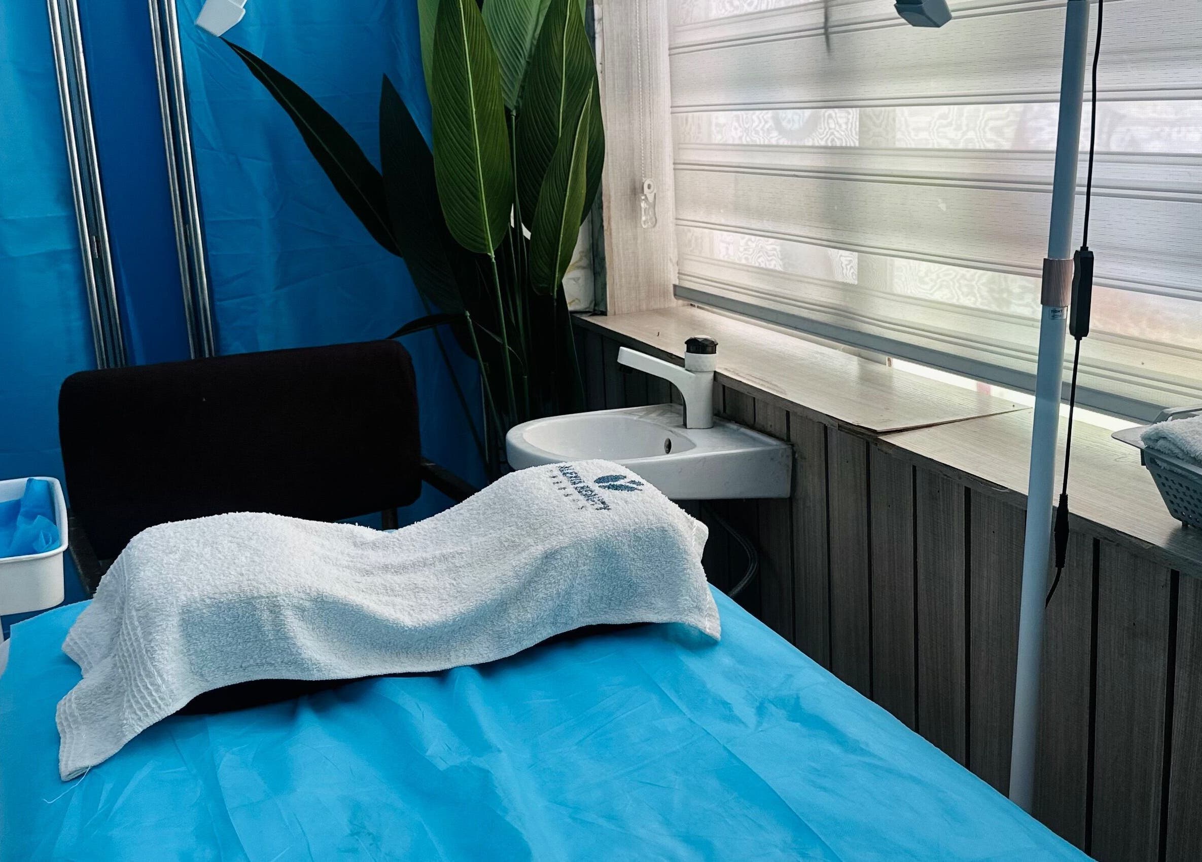 Relaxing treatment room at ABT MED SPA in Lekki, Lagos, NG, featuring spa bed and calming decor.