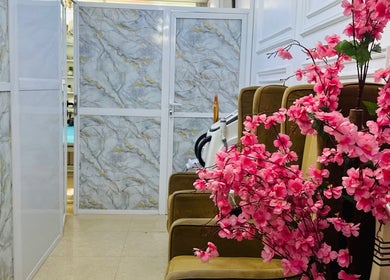 Chic ABT MED SPA entrance with stylish decor and floral arrangements in Lekki, Lagos, NG.