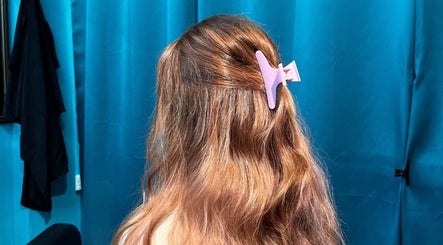 Beautifully styled hair with a clip at Jnal Gunthink & Jnal Salon, Bandar Penawar, Johor Darul Ta'zim, MY.