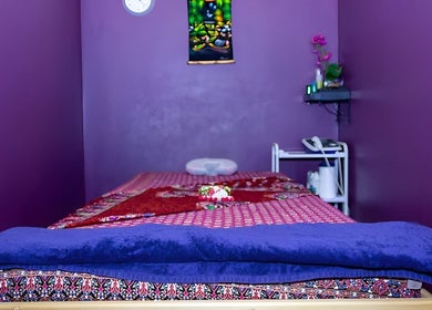 Peaceful massage room at Hua Hin Moon Thai Massage, Sunderland, England, GB, with vibrant purple decor.