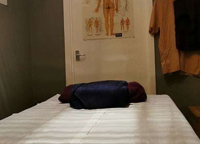 Relaxing massage room at Hua Hin Moon Thai Massage, Sunderland, England, GB, with a neatly arranged massage bed.