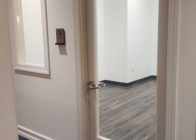 Open door to CHELLE HAIR DESIGN suite in Boca Raton, Florida, US, revealing a clean, modern interior.