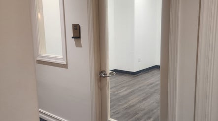 Open door to CHELLE HAIR DESIGN suite in Boca Raton, Florida, US, revealing a clean, modern interior.