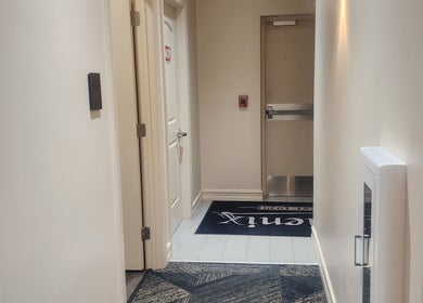 Entrance hallway of CHELLE HAIR DESIGN in Boca Raton, Florida, US, featuring stylish decor and lighting.