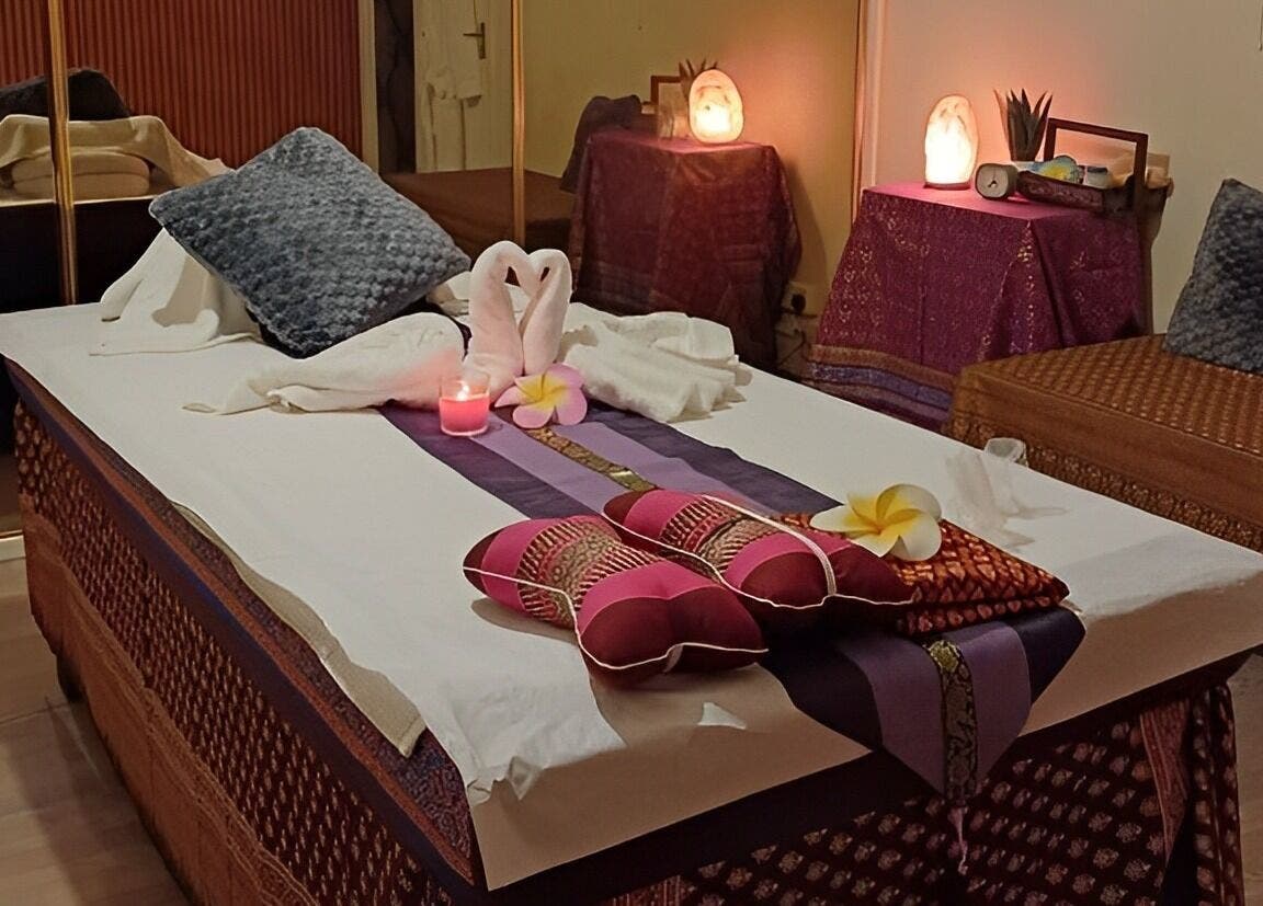 Relaxing ambiance at Tharawadee Thai Massage and Spa in Swindon, England, GB, with decorated massage bed.