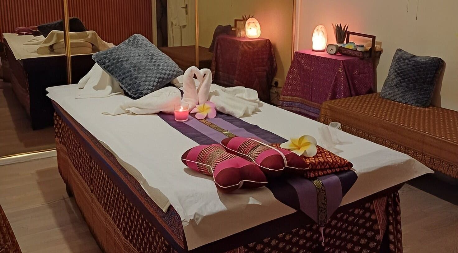 Relaxing ambiance at Tharawadee Thai Massage and Spa in Swindon, England, GB, with decorated massage bed.