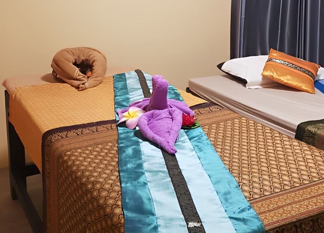 Serene massage beds at Tharawadee Thai Massage and Spa in Swindon, England, GB, with decorative elements.