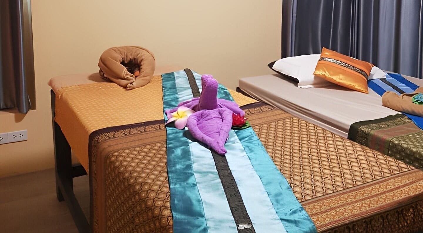 Serene massage beds at Tharawadee Thai Massage and Spa in Swindon, England, GB, with decorative elements.