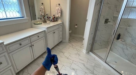 Pristine bathroom cleaned by Maid To Sparkle in Rochdale, England, GB, showcasing spotless tiles and organized vanity.