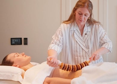Therapist performing a relaxing massage at The Bothy x Elethea, Huntington, England, GB.