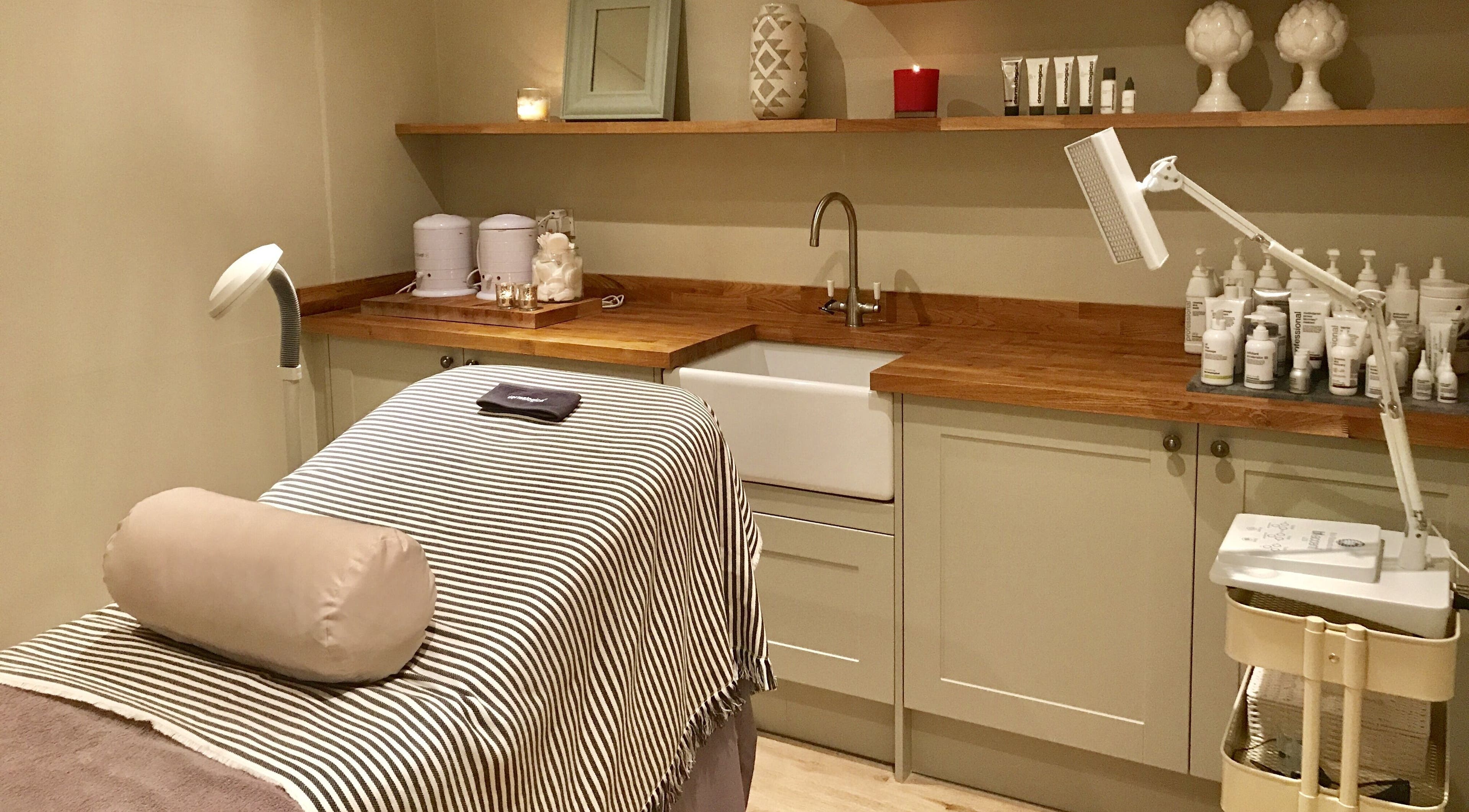 Cozy treatment room at The Bothy, York, England, GB, with a massage table and soothing decor.