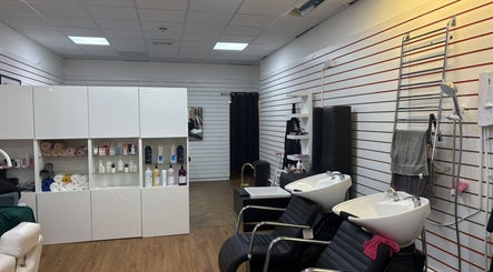 Modern salon interior of Fifi hair &beauty in Ashton-under-lyne, England featuring stylish washing stations.