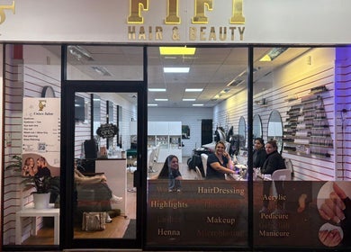 Fifi hair & beauty salon entrance with staff and clients, Ashton-under-lyne, England, GB.