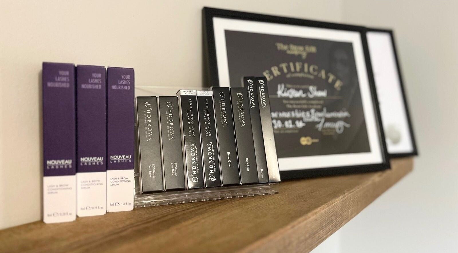 Product and certificate display at Brows By KD, Worksop, England, GB showcasing beauty and wellness excellence.
