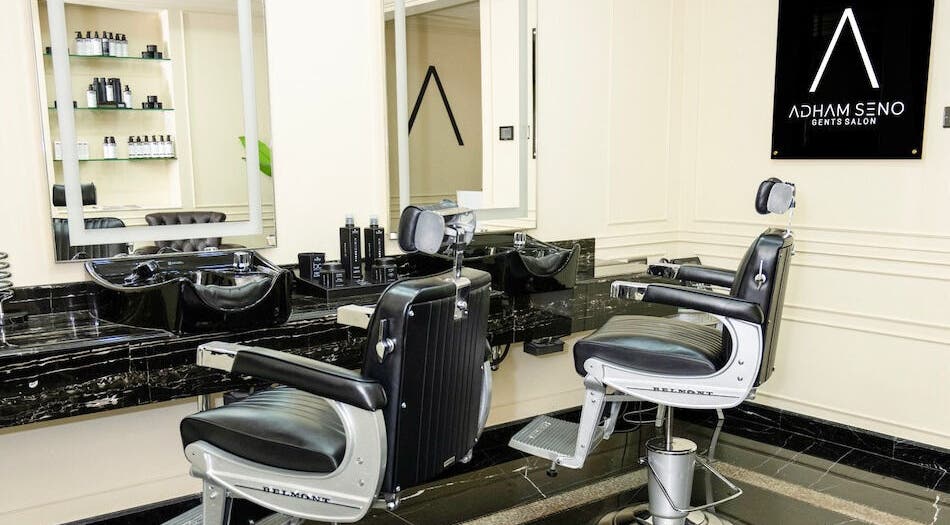 Interior of Adham Seno Gents Salon in Dubai, Dubai, AE featuring sleek barber chairs and modern decor.