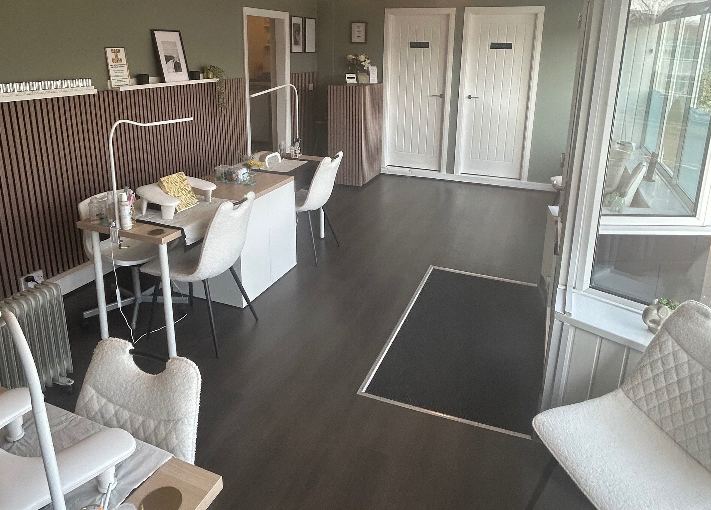 Chic interior of Prettyme Beauty Allestree, Derby, England, GB, featuring stylish manicure stations.