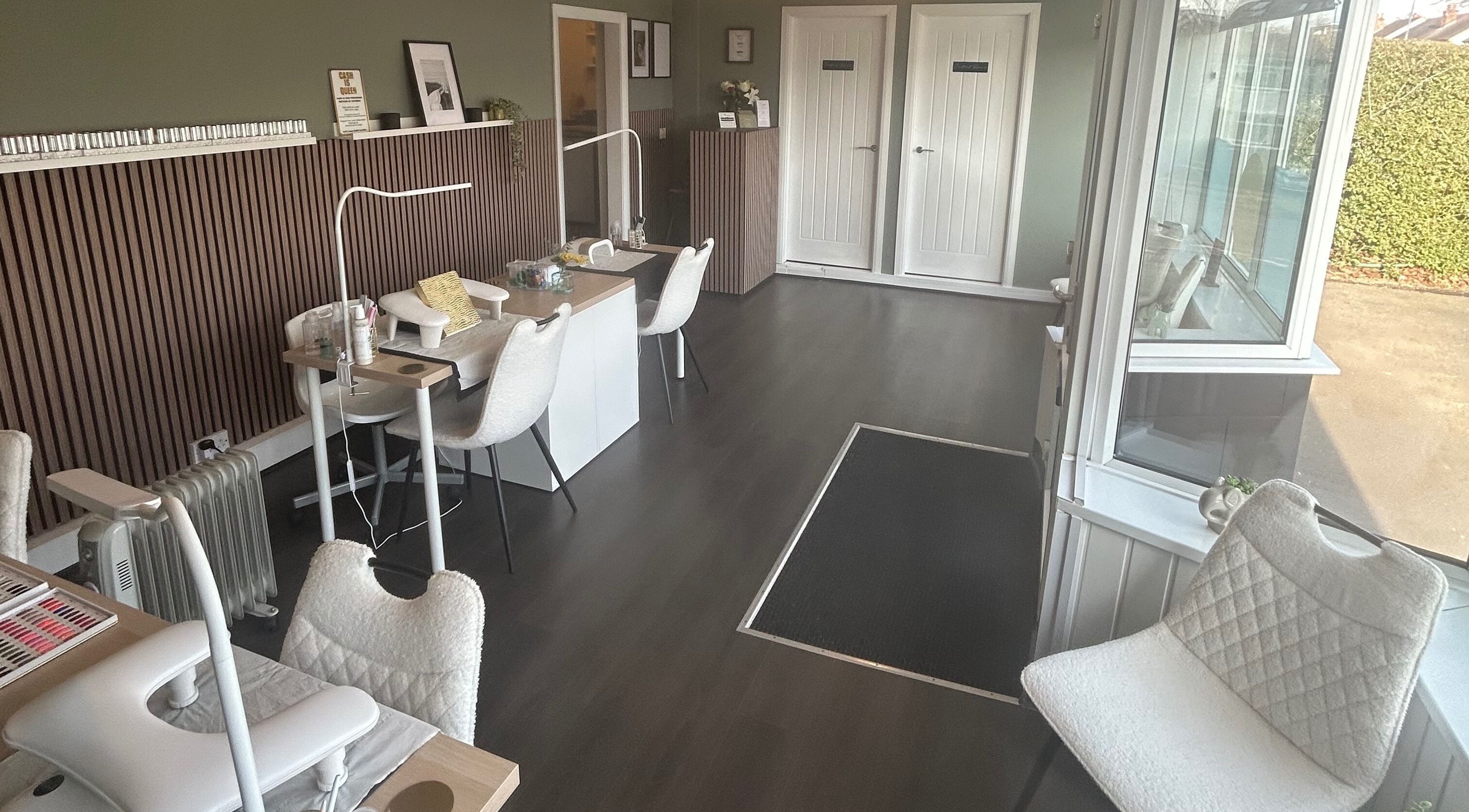 Chic interior of Prettyme Beauty Allestree, Derby, England, GB, featuring stylish manicure stations.