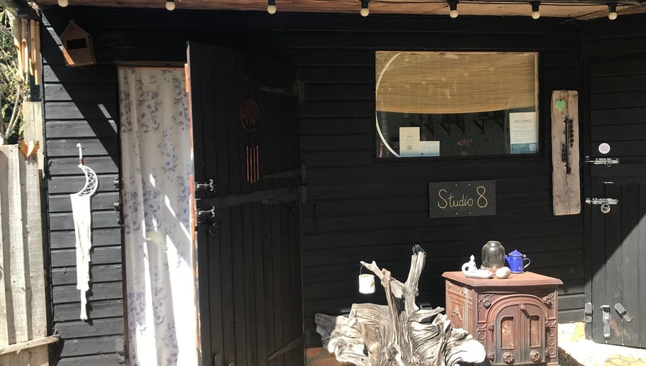 Entrance of Studio 8 at In8 Wellbeing, Milton Ernest, England, GB, featuring a rustic wooden décor.
