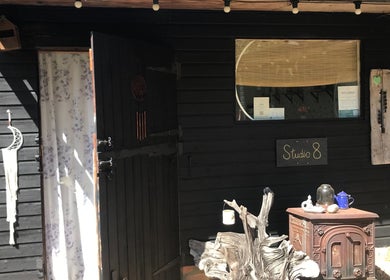 Entrance of Studio 8 at In8 Wellbeing, Milton Ernest, England, GB, featuring a rustic wooden décor.
