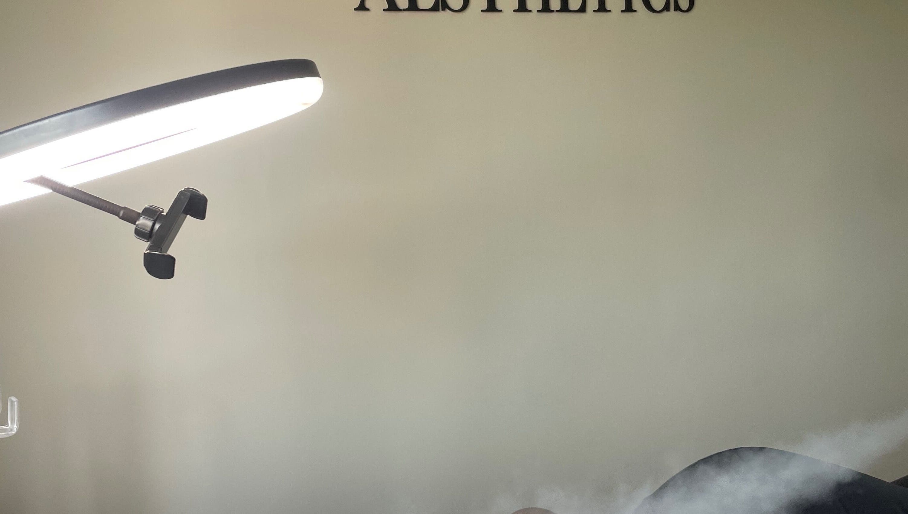 Facial treatment in progress under advanced lighting at Medi Dermis Aesthetics, Chorley, England, GB.