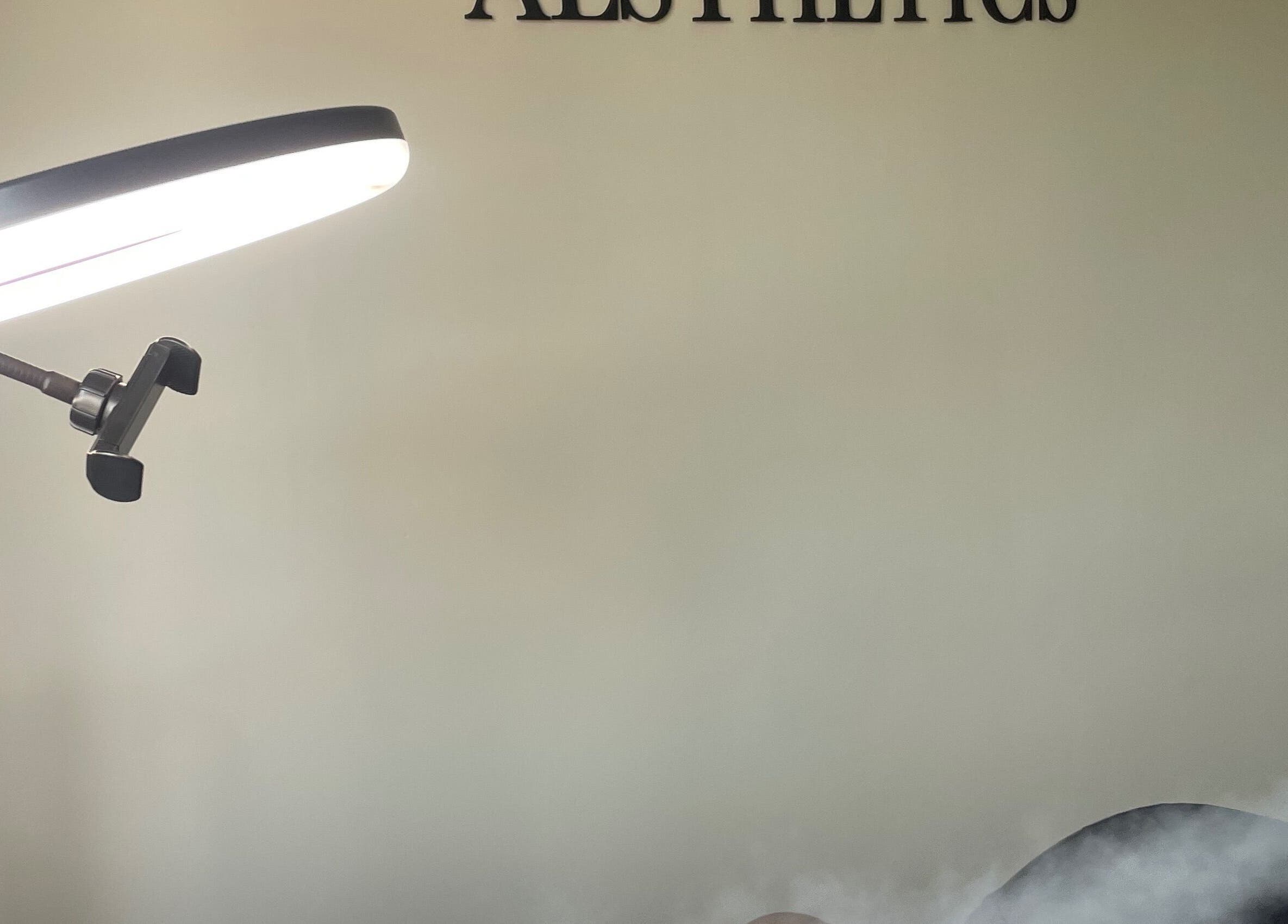 Treatment room at Medi Dermis Aesthetics, Chorley, England, with modern lighting and tranquil atmosphere.