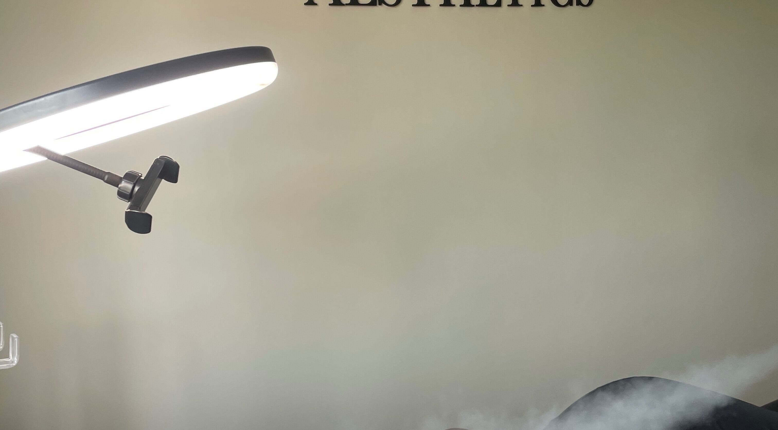 Treatment room at Medi Dermis Aesthetics, Chorley, England, with modern lighting and tranquil atmosphere.