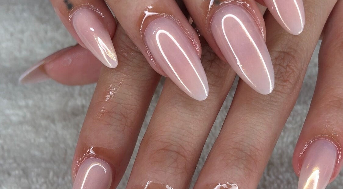 Elegant pink manicure at Gaia the Nail Bar, Johannesburg, Gauteng, ZA, showcasing glossy, perfectly shaped nails.