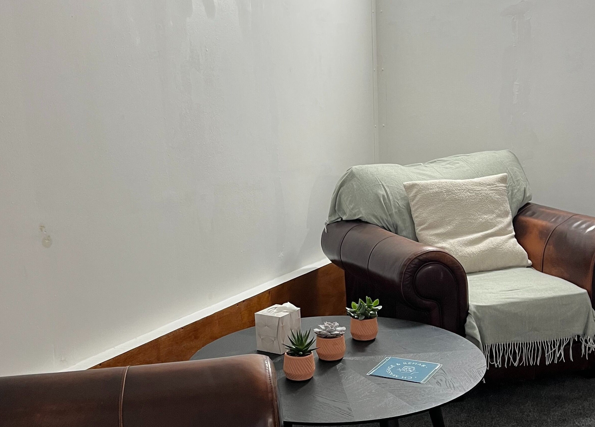 Relaxing leather armchair setup at CH Massage & Rehab, Poltimore, England, GB for a serene experience.