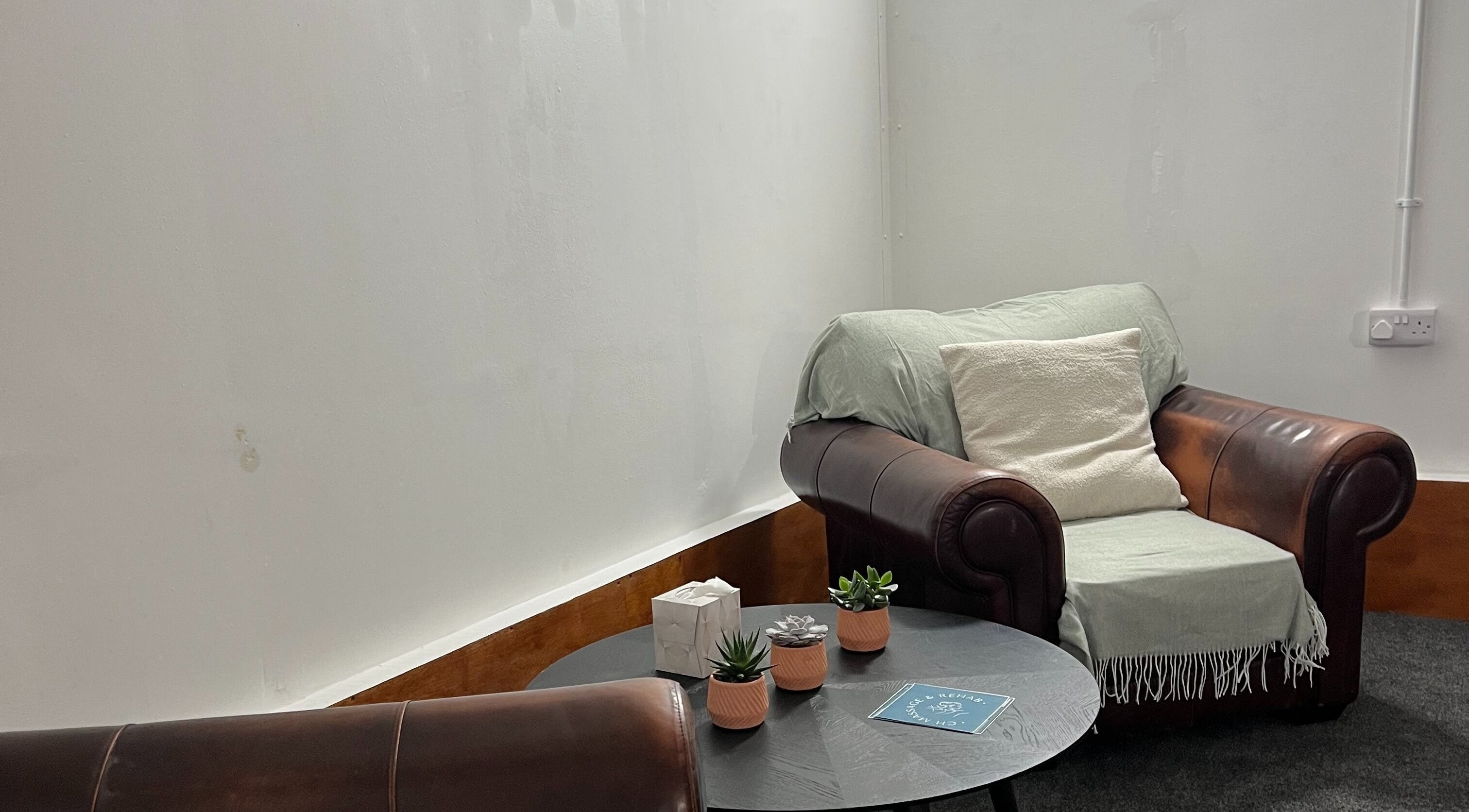 Relaxing leather armchair setup at CH Massage & Rehab, Poltimore, England, GB for a serene experience.