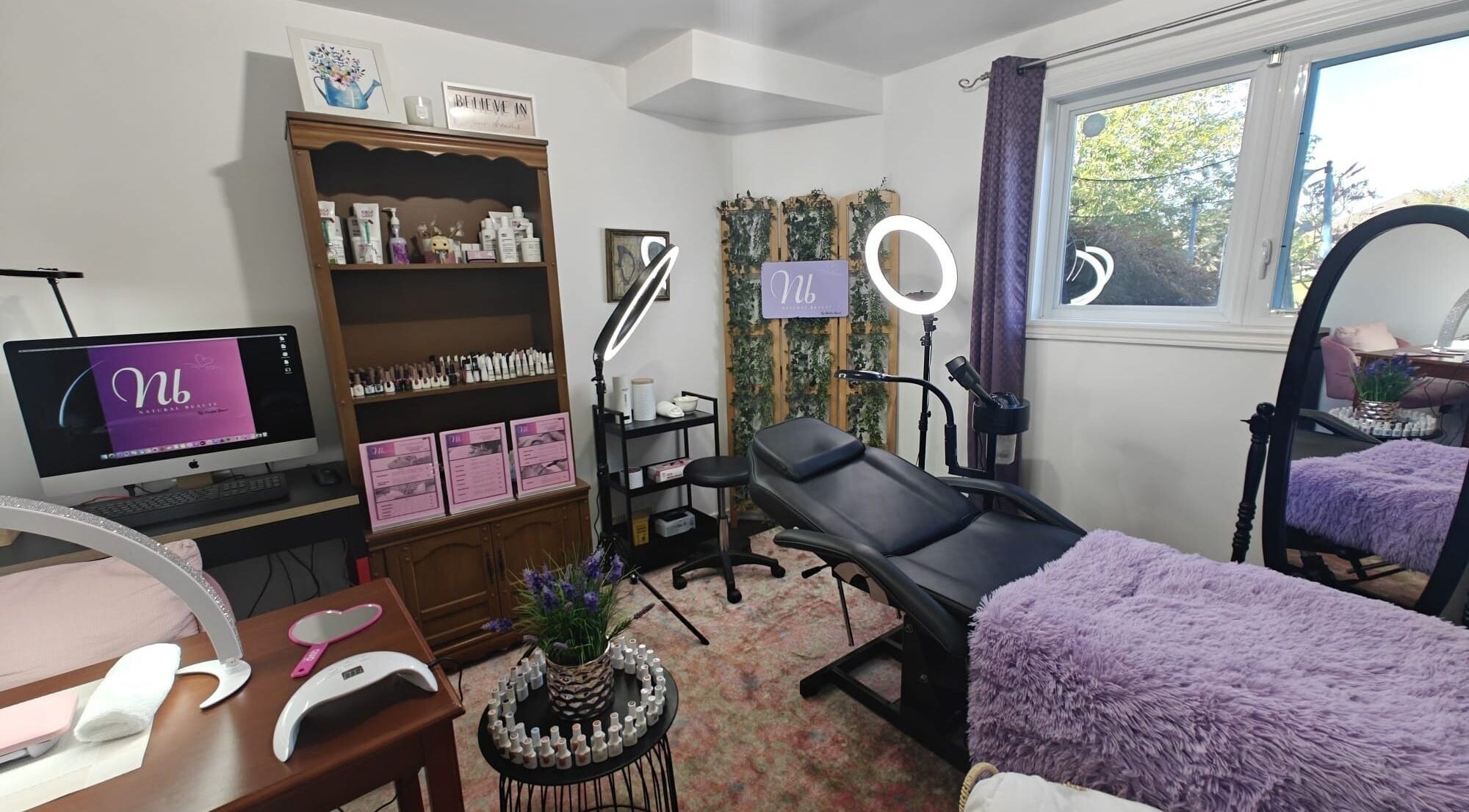 Relaxing beauty studio at Natural Beauty by Nadia Bane in London, Ontario, CA, with treatment bed and decor.
