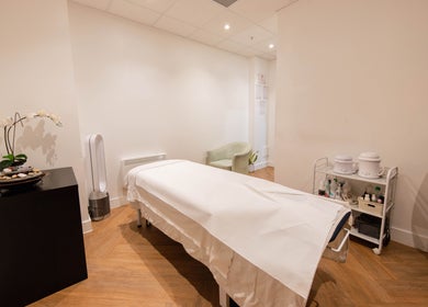 Calm treatment room at Francisca Wellbeing Studio, London, England, GB, with massage table and serene decor.